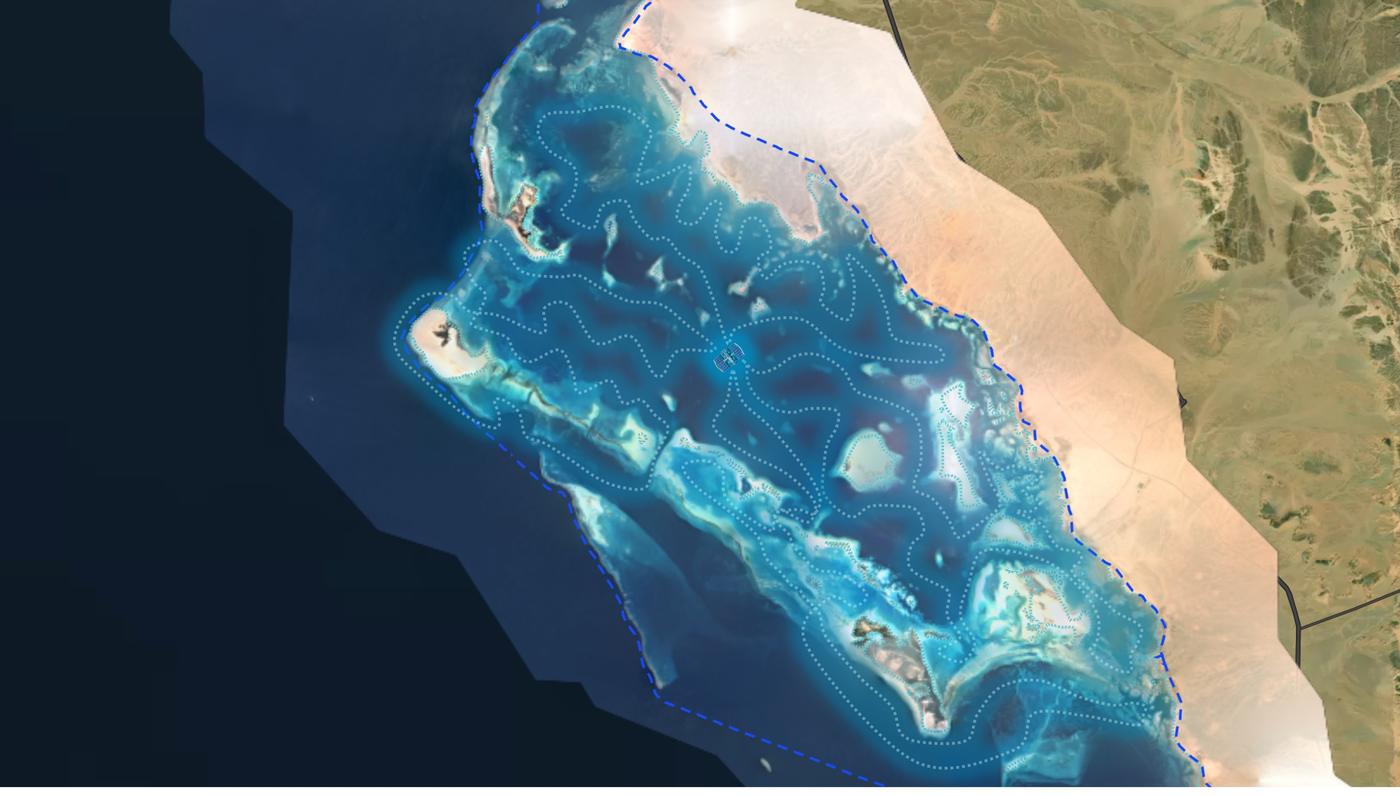 Satellite view of a Red Sea reef and lagoon complex with a service zone boundary and vessel routes plotted across it